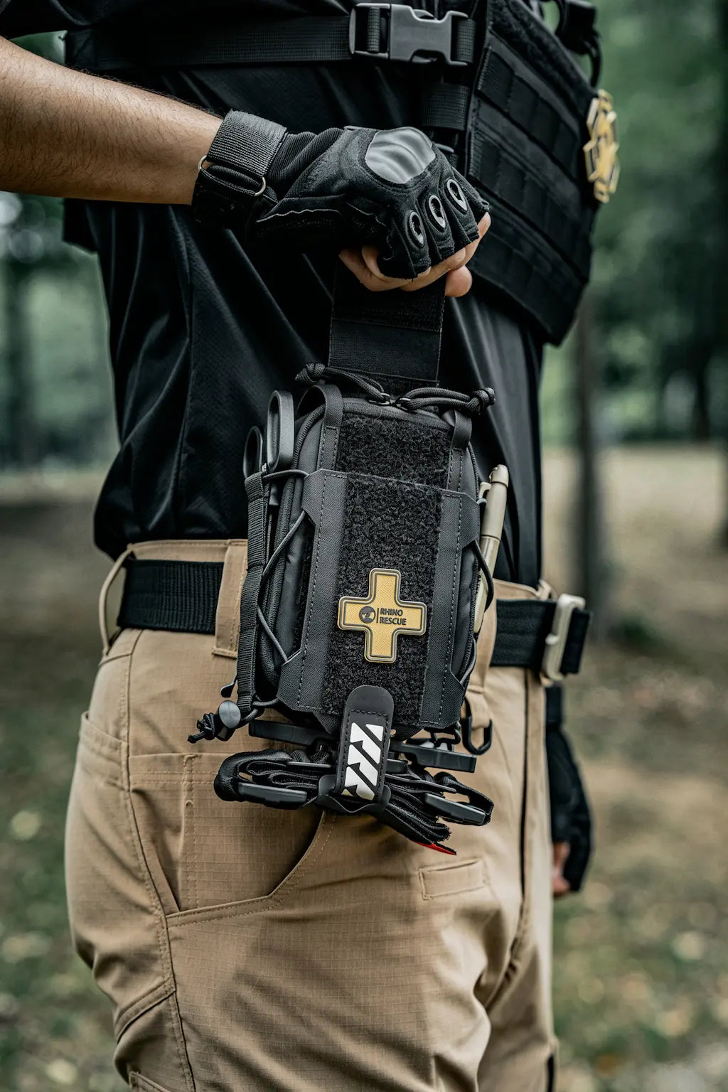 Rhino Rescue black tactical IFAK pouch mounted on a belt